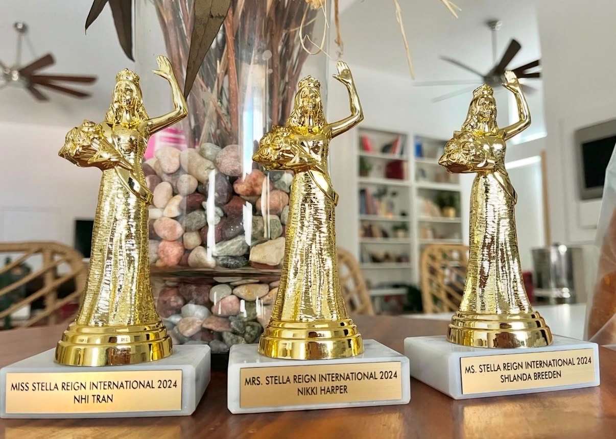 The Stella Reign International 2024 winners' trophies — Miss Nhi Tran, Mrs Nikki Harper, and Ms Shlanda Breeden